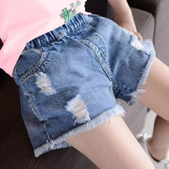 Short jeans rasgado con flecos