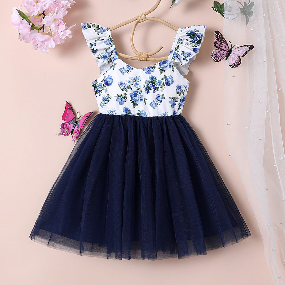 Vestido blanco con estampas de flores y falda de tul azul marino