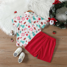 Cargar imagen en el visor de la galería, Camisa blanca con estampas navideñas , moño y short rojo
